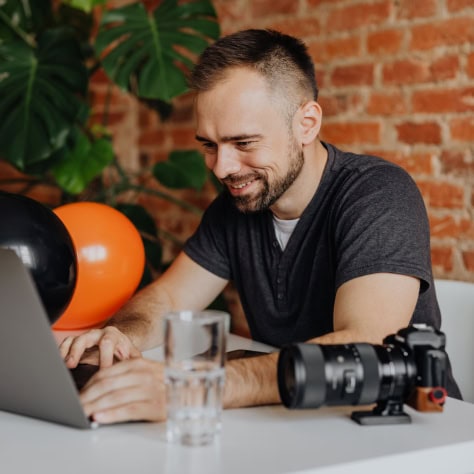 Photographer working on laptop